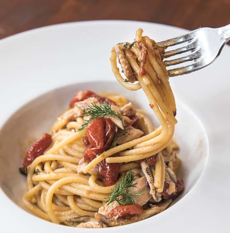 A forkful of Roman pasta lifted from the plate