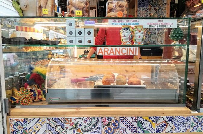 A tiled counter of supplì and arancini in a Roman friggitoria